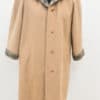 Elegant beige wool coat with plaid details, perfect for stylish layering in any season.