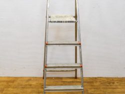 Durable aluminum ladder with four anti-slip steps, perfect for safe DIY projects and home tasks.