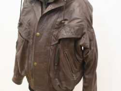 Stylish oversized brown leather jacket with adjustable features and functional pockets for versatile wear.