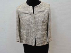 Elegant beige cropped jacket with luxurious texture and versatile three-quarter sleeves for stylish outfits.