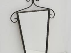 Stylish triangular wall mirror with twisted wrought iron frame, perfect for any elegant décor.