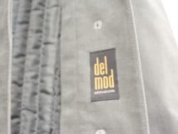 Chic gray suede jacket by Del Mod with gold label, perfect for stylish layering.