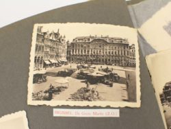 Vintage Brussels Grand Place image capturing lively marketplace and exquisite historic architecture.