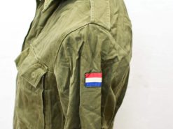 Vintage olive green military jacket with vibrant tricolor shoulder patch, perfect for stylish outdoor wear.