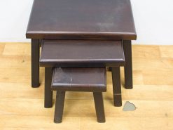 Elegant dark wood nesting tables with vintage charm for versatile home decor.