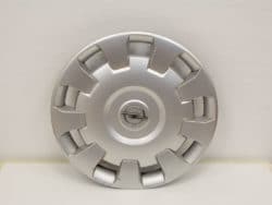 Sleek Opel hubcap with polished finish and dynamic spoke design for stylish wheel protection.