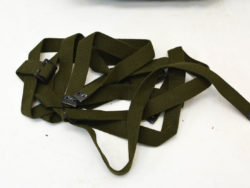 Durable olive green straps with clips for secure attachment in outdoor adventures.