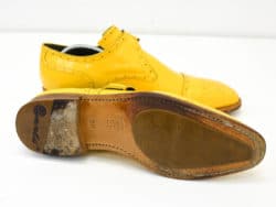 Stylish yellow leather monk strap shoes, perfect for making a statement on any occasion.