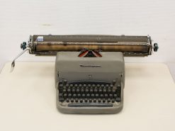 Classic gray Remington typewriter: timeless craftsmanship and a nostalgic symbol of writing history.