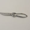 Vintage stainless steel kitchen scissors with ergonomic grips for precise and effortless cutting.