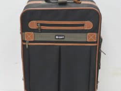 Stylish black suitcase with tan accents, organized pockets, and smooth wheels for effortless travel.