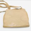 Sleek tan leather handbag with minimalist design, ideal for any occasion and versatile styling.