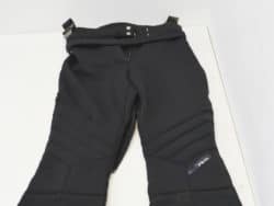 Black padded winter pants for skiing and outdoor adventures, offering comfort and style.