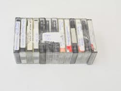 Nostalgic vintage cassette tapes with handwritten labels showcasing personal music memories and collections.