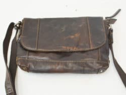 Timeless dark brown vintage leather crossbody bag with adjustable strap and stylish design.