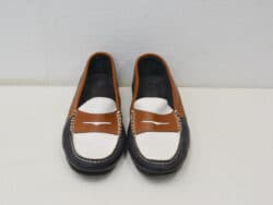 Chic brown and white loafers for effortless style and comfort in any casual setting.