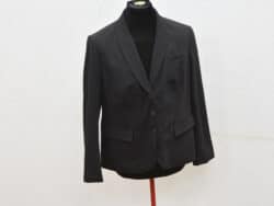 Elegant black blazer with notch lapels, ideal for versatile styling in any wardrobe.