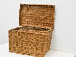 Charming wicker basket with lid for stylish storage and natural decor enhancement.