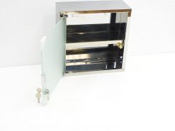 Sleek metal cabinet with frosted glass door for secure, stylish storage in modern interiors.