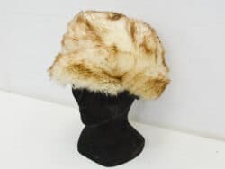 Chic cream faux fur hat for stylish winter warmth and vintage elegance.