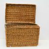 Elegant wicker basket with lid for stylish storage of toys and blankets.