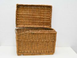 Elegant wicker basket with lid for stylish storage of toys and blankets.