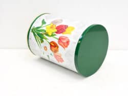 Vibrant floral storage container with a green lid for stylish and practical home organization.