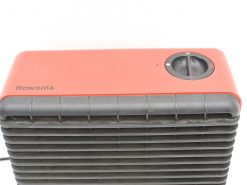 Compact Rowenta heater in sleek red and black for efficient and stylish home heating.