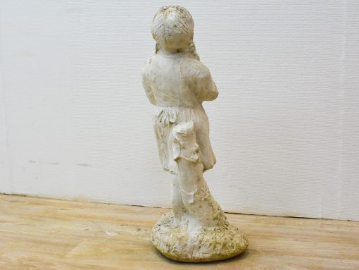 Charming back view of a child sculpture, capturing innocence and curiosity in nostalgic decor.