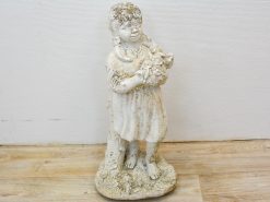 Charming vintage statue of a smiling girl with flowers, perfect for whimsical garden decor.