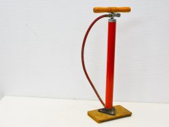 Vintage red bicycle pump with wooden handle, ideal for cycling enthusiasts and retro collectors.