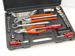 Vintage tool kit with red grips, expertly organized for DIY and professional tasks.