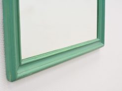 Elegant vintage turquoise mirror with a rustic frame, perfect for enhancing any interior decor.