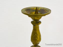 Elegant yellow candlestick with vintage charm, perfect for enhancing any decor.