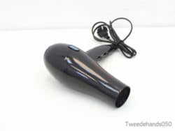 Stylish black hair dryer with ergonomic design for efficient drying and versatile styling.