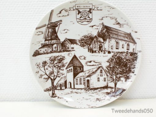 Vintage decorative plate showcasing a windmill and village scene in charming sepia tones.