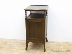 Charming vintage wooden nightstand with storage, warm tones, and elegant curved design for any room.