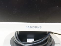 Stylish white Samsung monitor with organized cables for a modern and efficient workspace.