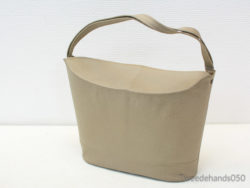 Chic beige handbag with minimalist design, perfect for everyday wear and versatile styling.