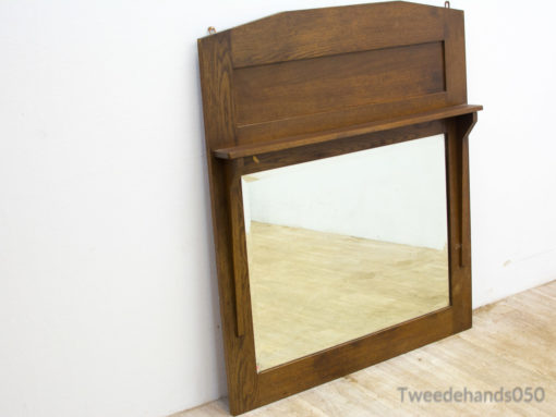 Rustic wooden mirror with shelf, blending vintage elegance and practicality for any space.