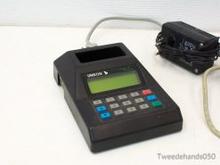 Vintage Unikon EC 82466 POS terminal with colorful keypad and green LCD screen for efficient transactions.