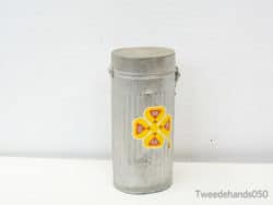 Vintage metal canister with vibrant floral design, perfect for decor and storage options.