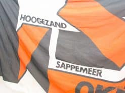 Vibrant flag of Hoogezaand and Sappemeer celebrating community pride and unity in bold colors.