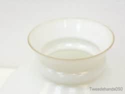 Elegant white bowl with gold rim, ideal for luxury dining and sophisticated decor.