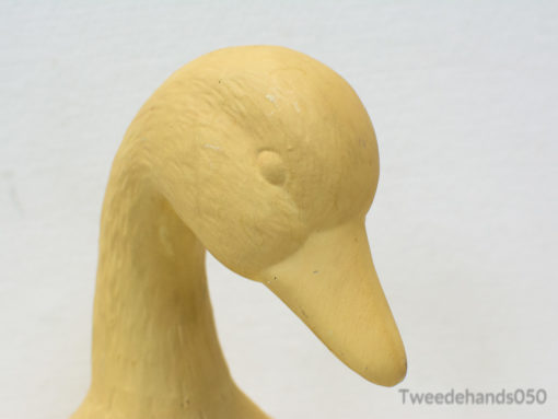 Playful yellow duck sculpture, ideal for adding charm to modern and whimsical interiors.