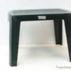 Durable black plastic stool with textured top, ideal for versatile indoor and outdoor use.