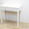 Sleek white console table with marble top and practical drawers for modern interior organization.