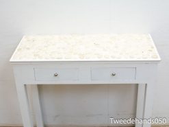 Elegant white console table with textured stone mosaic top and functional drawers for modern decor.