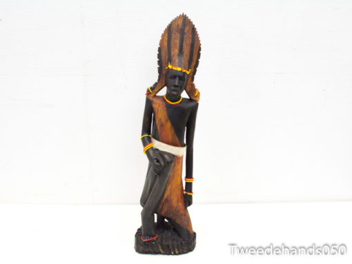 Elegant wooden sculpture celebrating African cultural heritage and craftsmanship with intricate details.