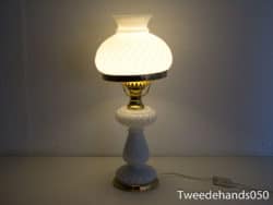 Elegant white lamp with gold base, perfect for stylish home lighting and decor.